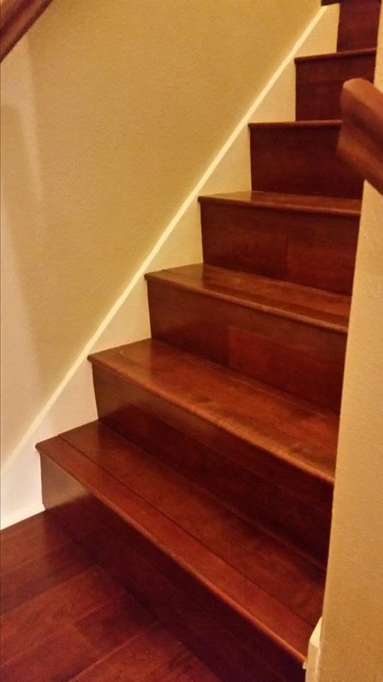 Completed dark hardwood staircase after refinishing